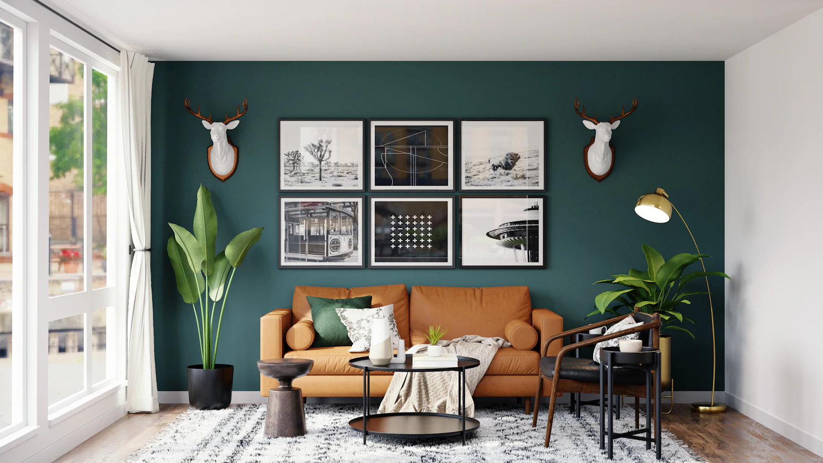 Wohnzimmer in warmen Grüntönen mit Sofa und Bilderwand